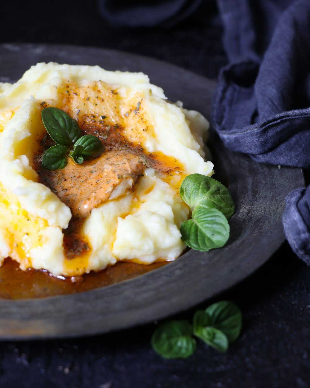 a plate of mashed potatoes topped with gravy