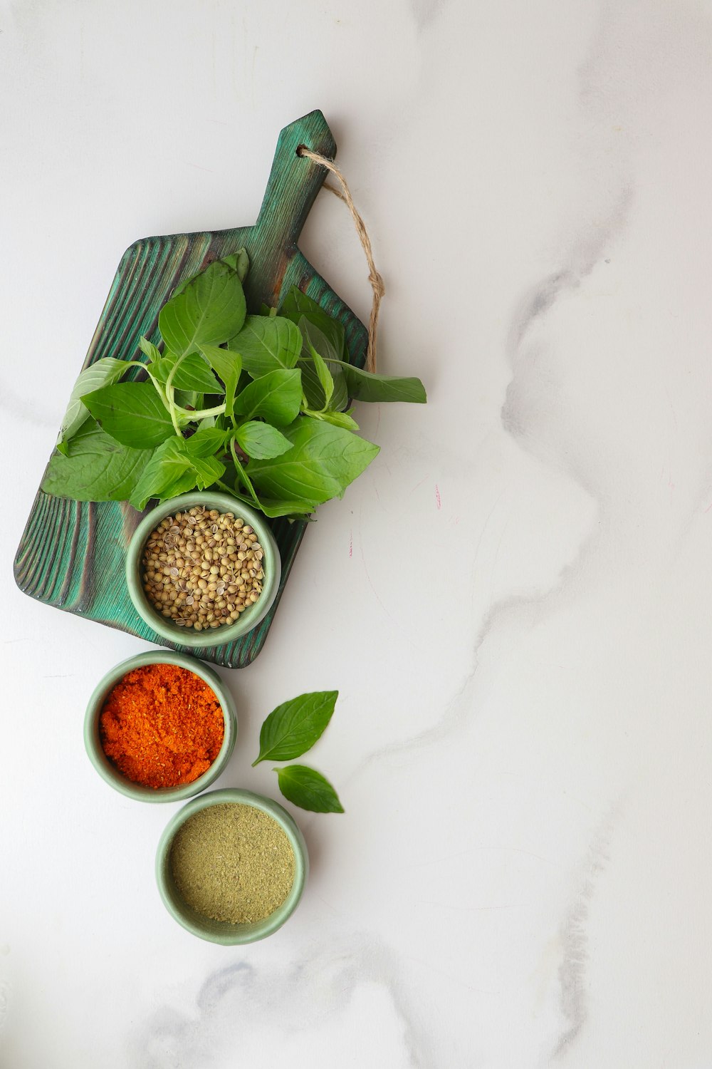 a table topped with bowls filled with different types of spices