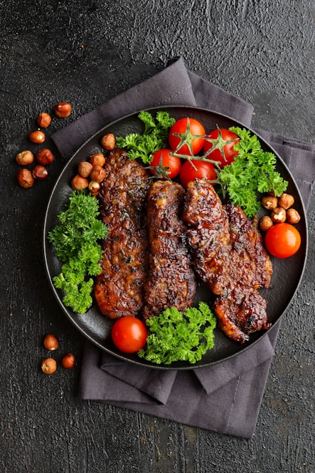 a plate of meat and vegetables on a table