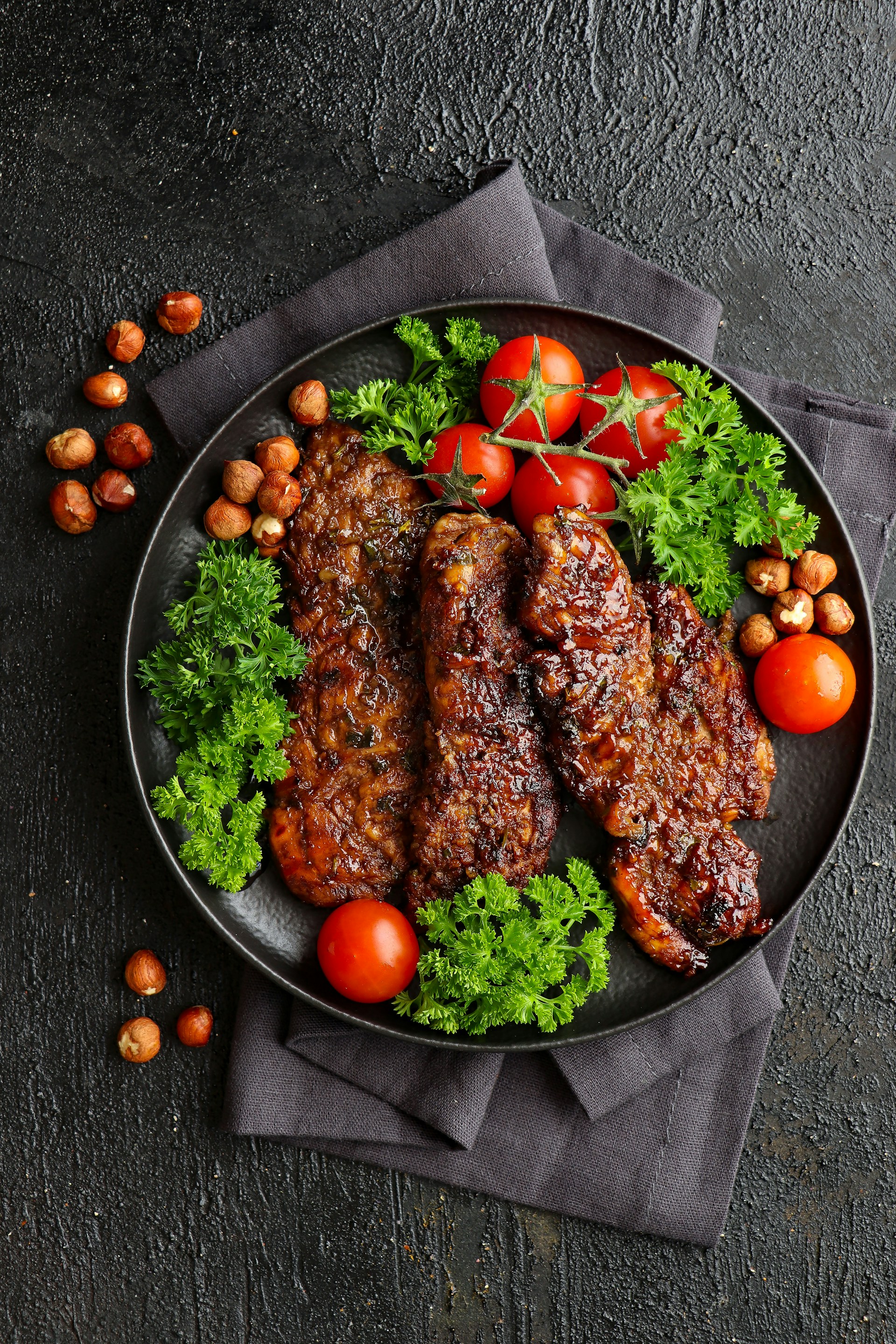 a plate of meat and vegetables on a table