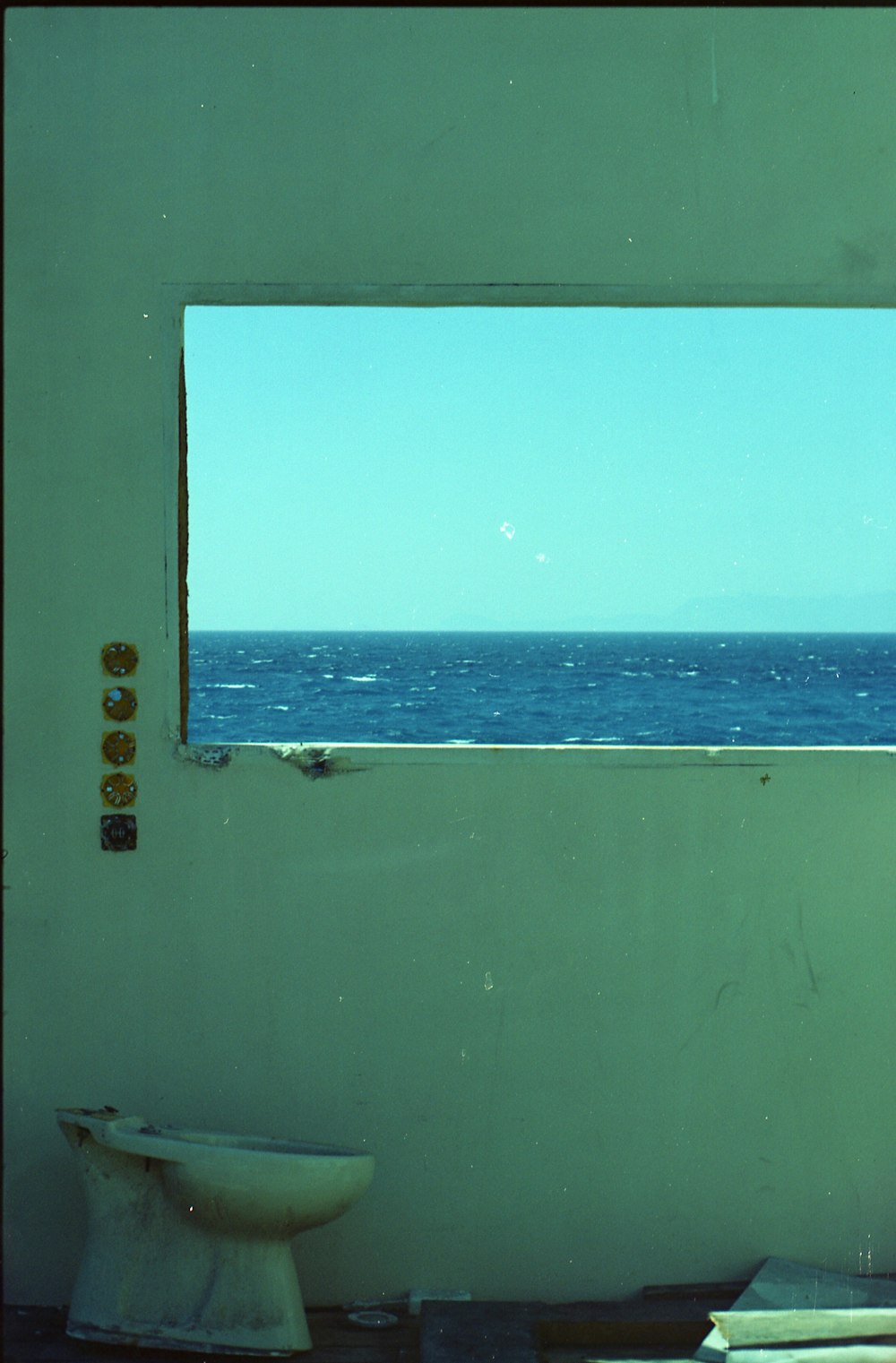 a bathroom with a view of the ocean