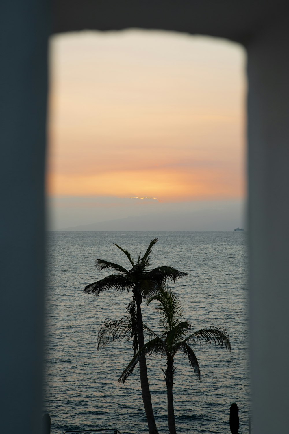 a view of the ocean through a window