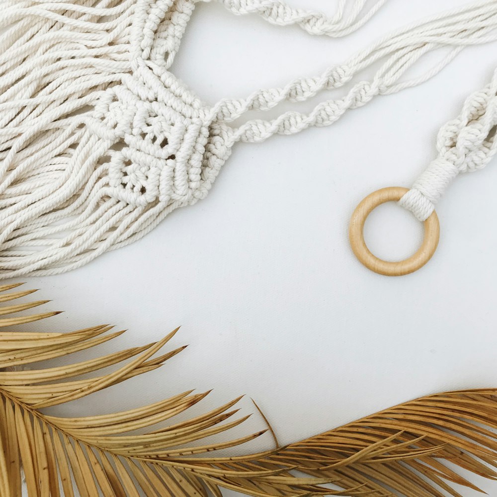 a necklace with a wooden ring hanging from it