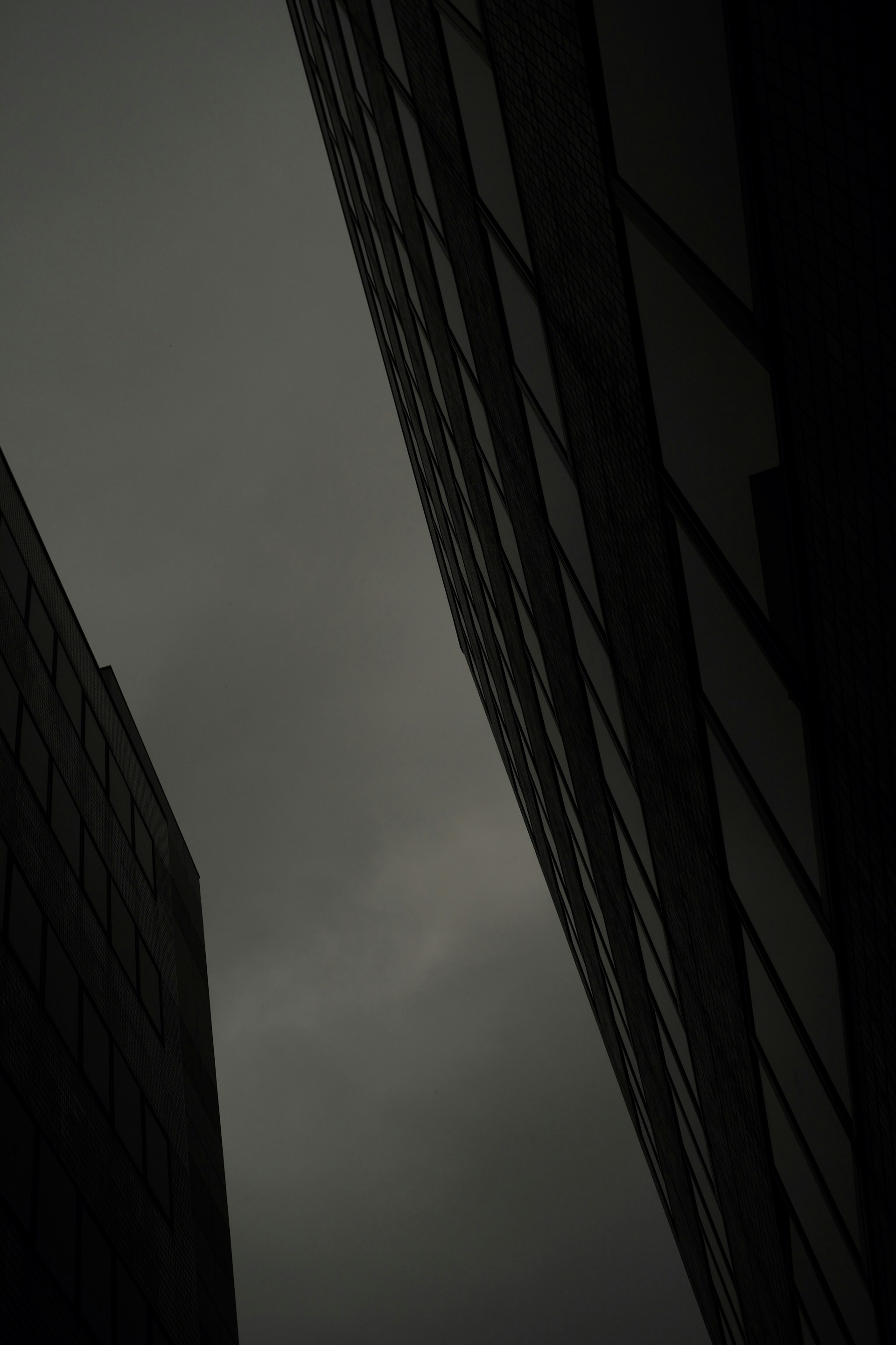 a couple of tall buildings sitting next to each other