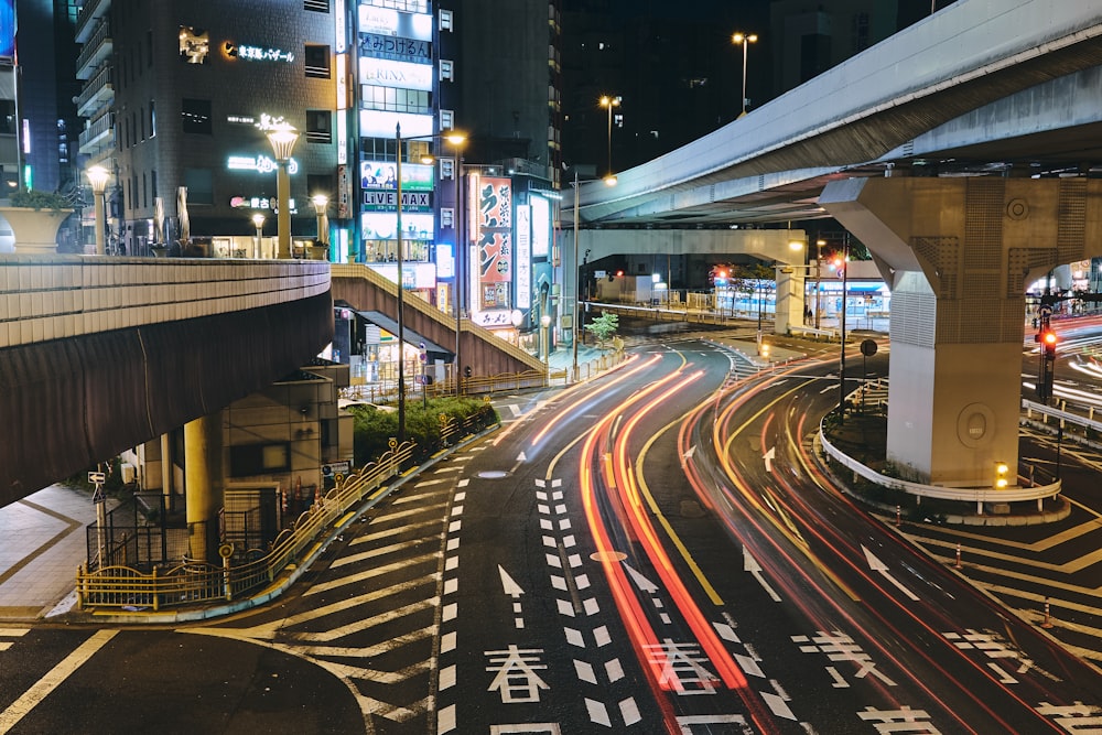 a busy city street at night with traffic lights