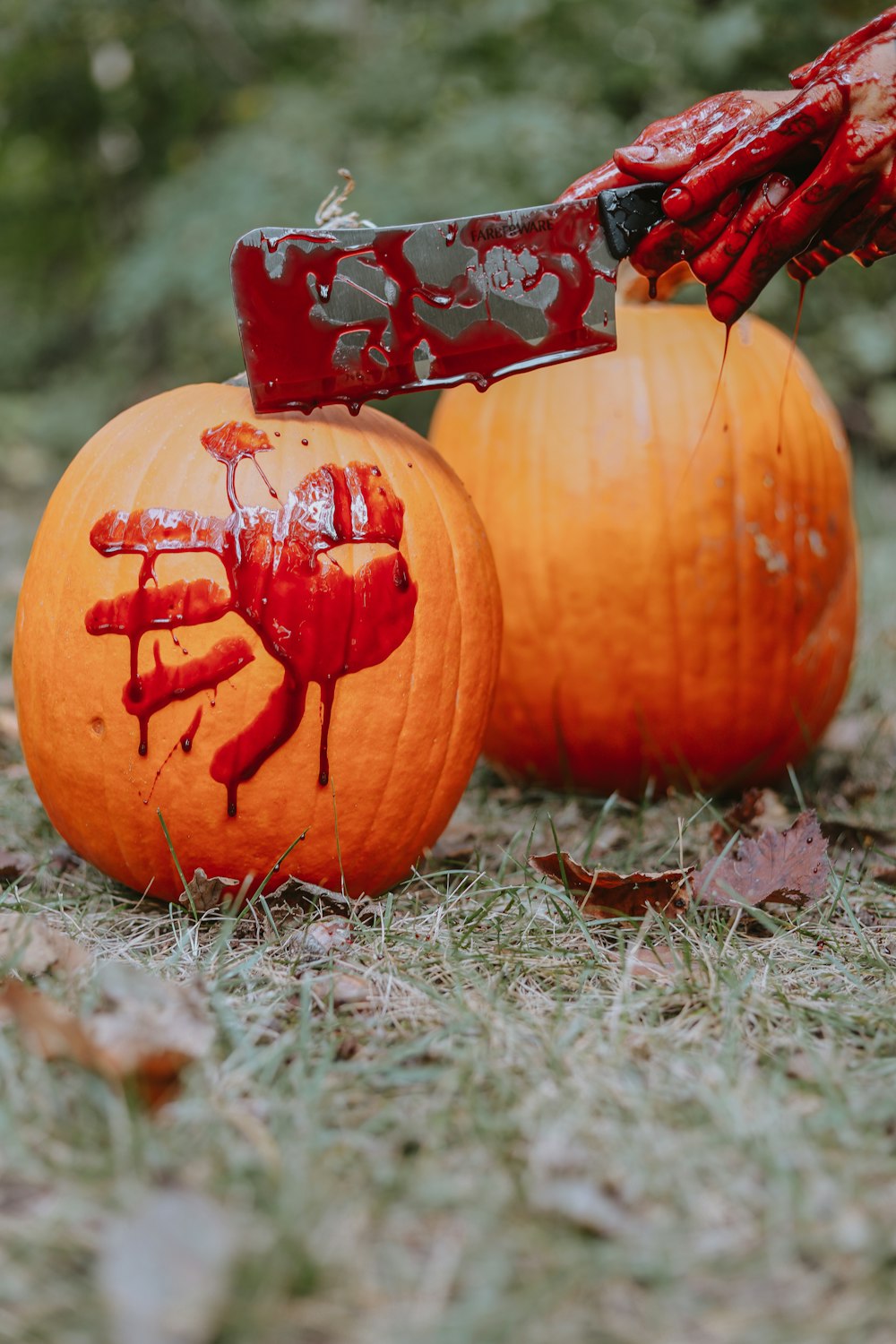 a knife sticking out of a carved pumpkin