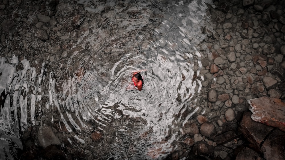 a person swimming in a body of water