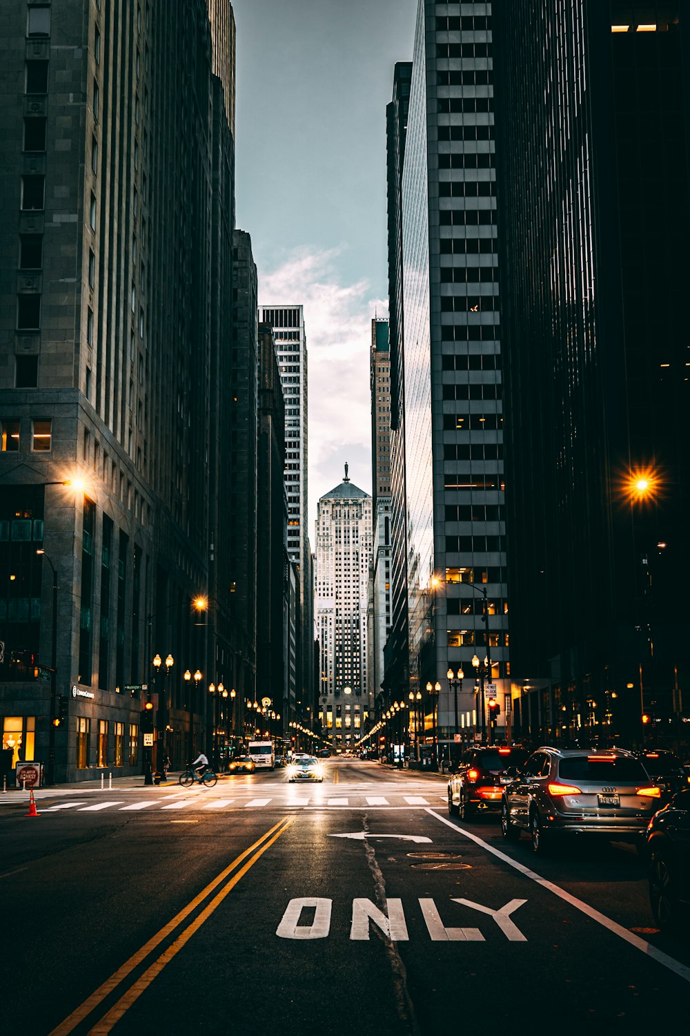 a city street filled with lots of tall buildings