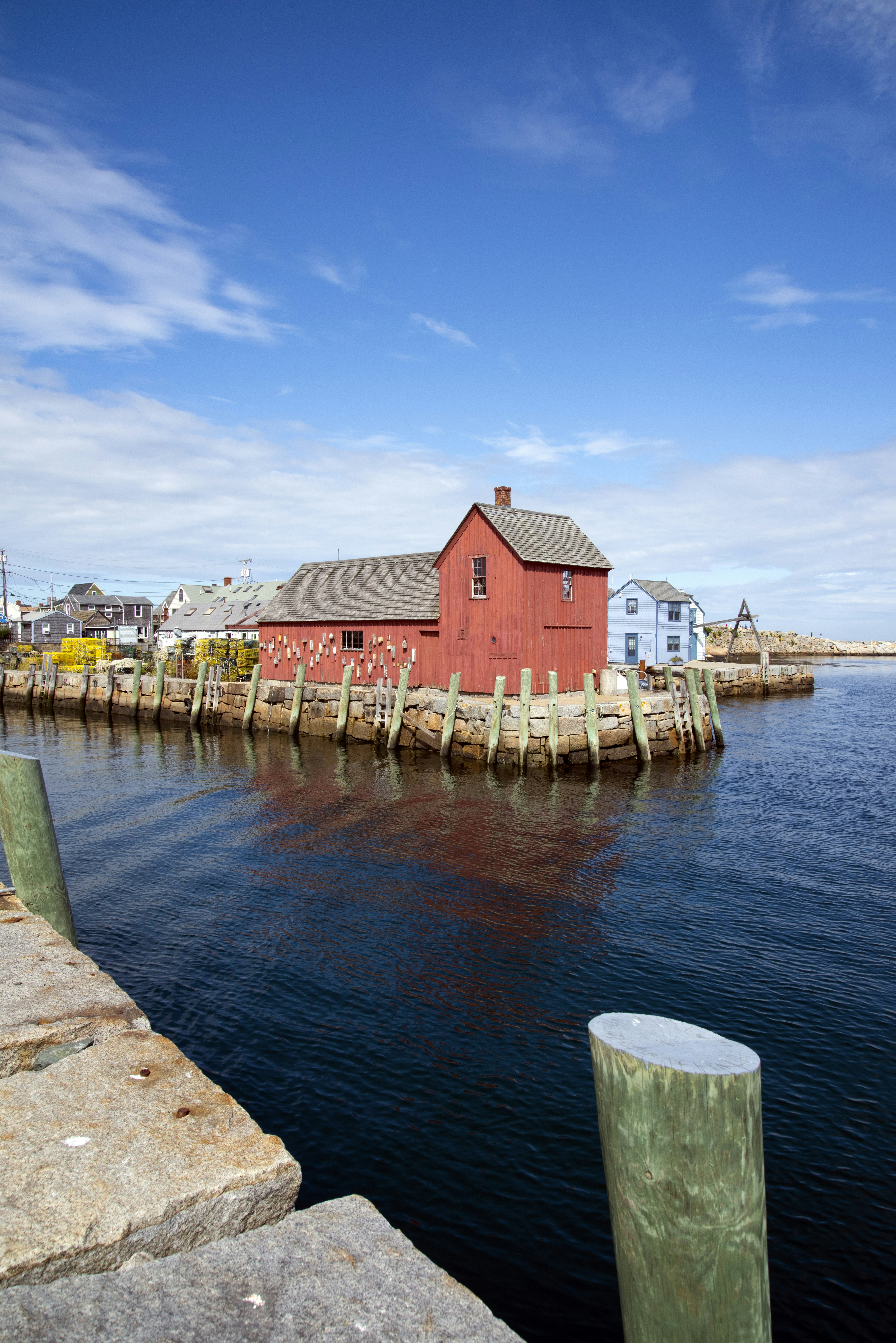 a red building sitting on top of a body of water