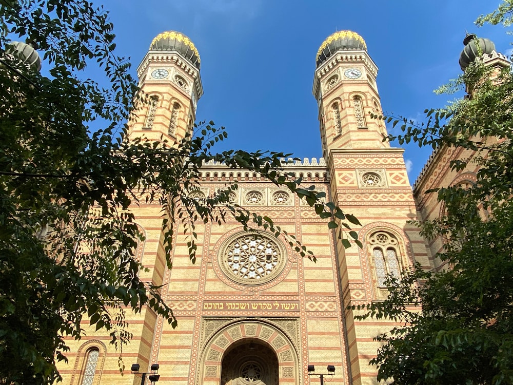 a large building with two towers and a clock