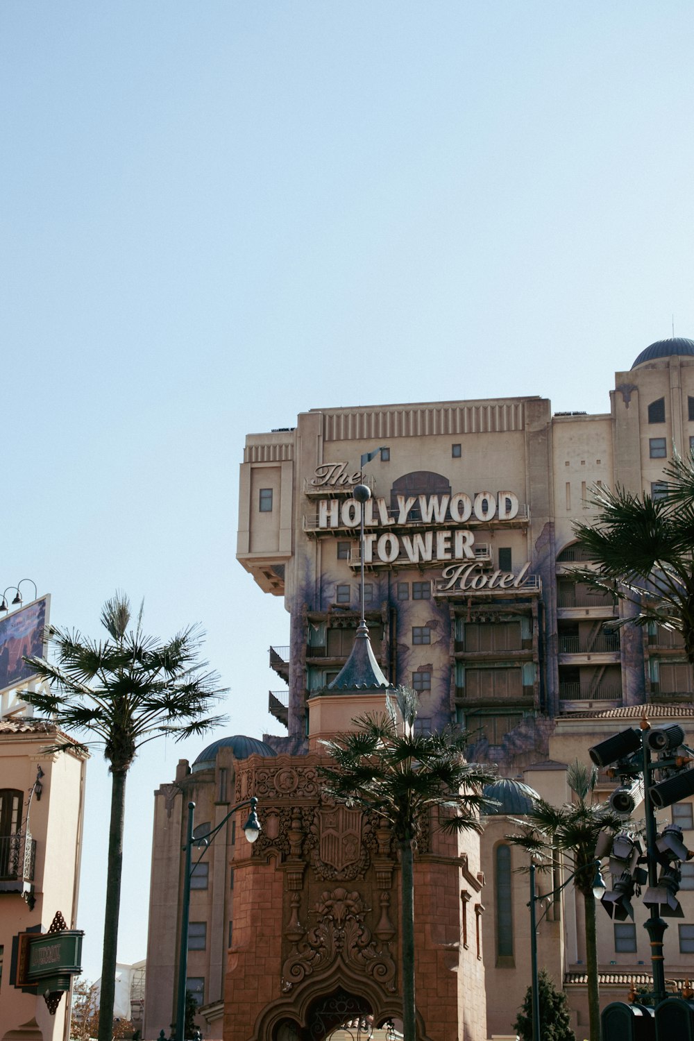 a tall building with a sign on top of it