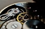 a close up of a watch face with the gears missing