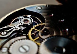 a close up of a watch face with the gears missing
