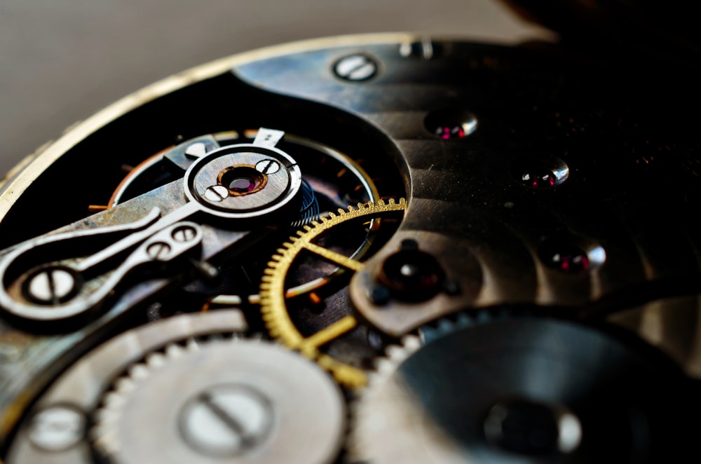 a close up of a watch face with the gears missing