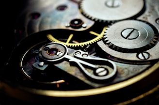 a close up of a watch face showing the gears