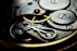 a close up of a watch face showing the gears