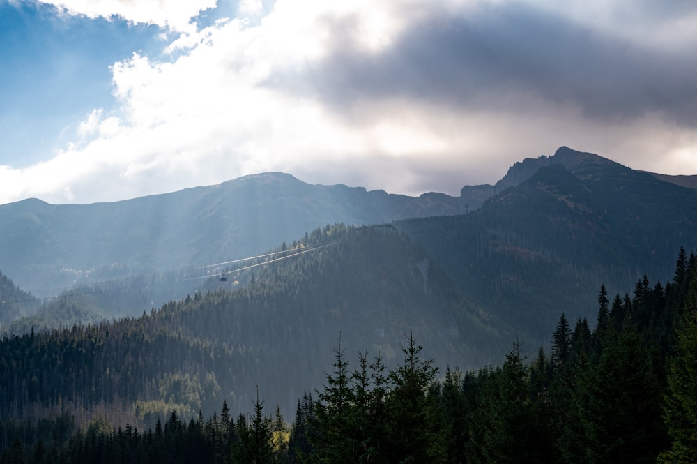 a view of a mountain range with a train on it