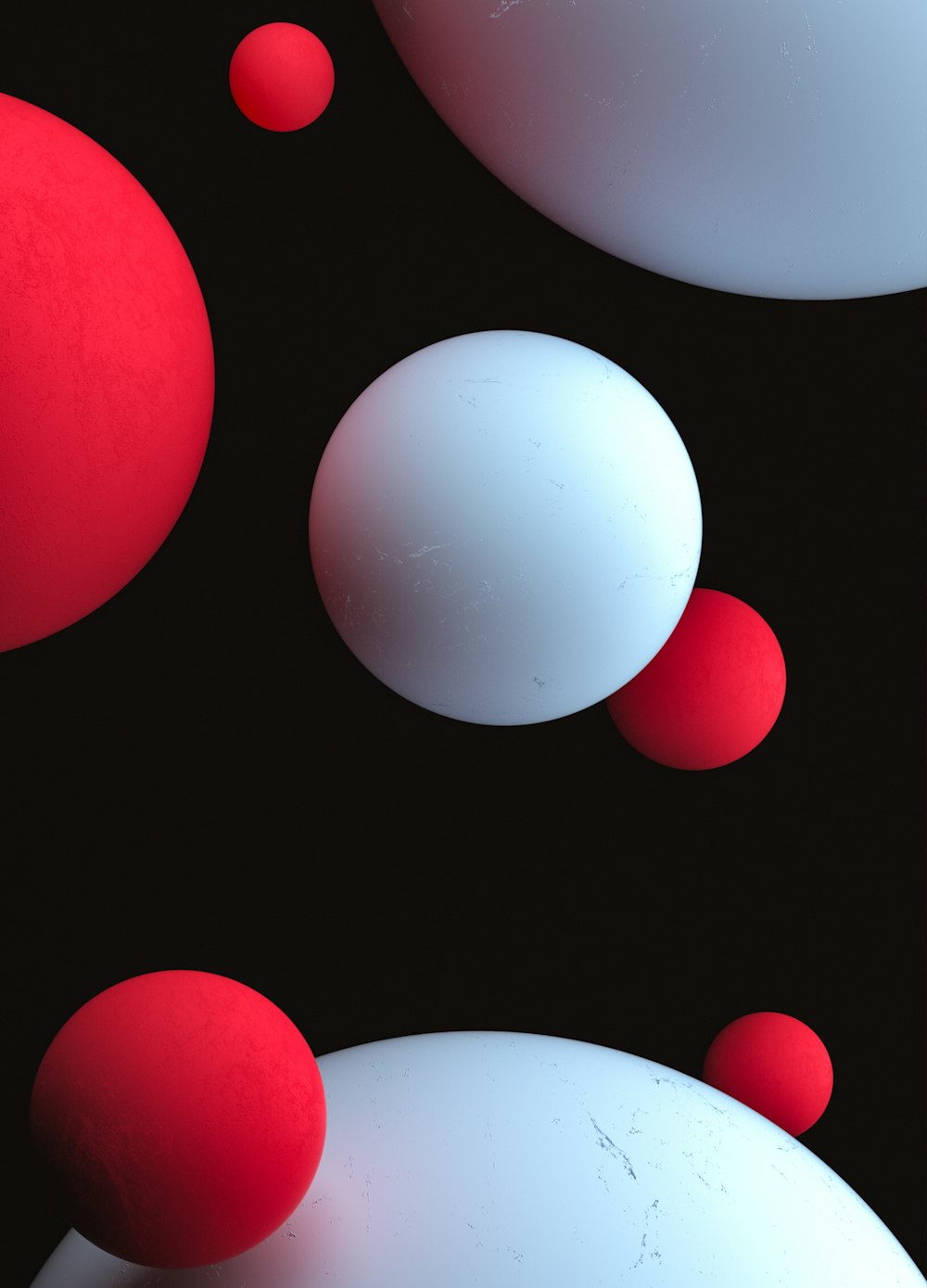 um grupo de bolas vermelhas e brancas flutuando no ar