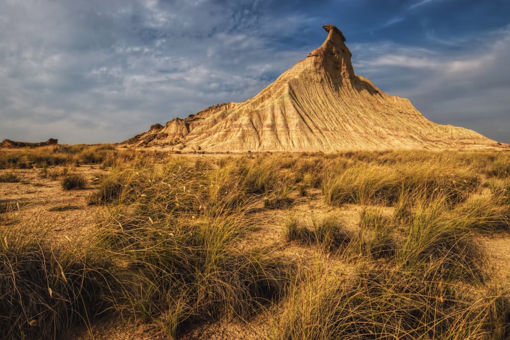 a large sand dune in the middle of a desert