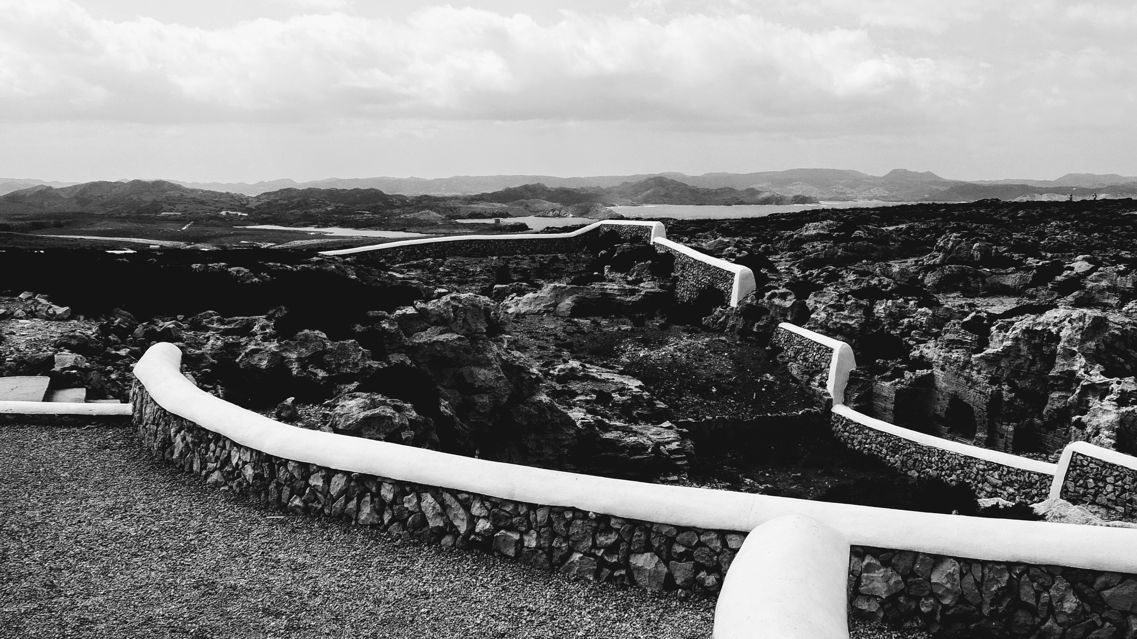 a black and white photo of a stone wall