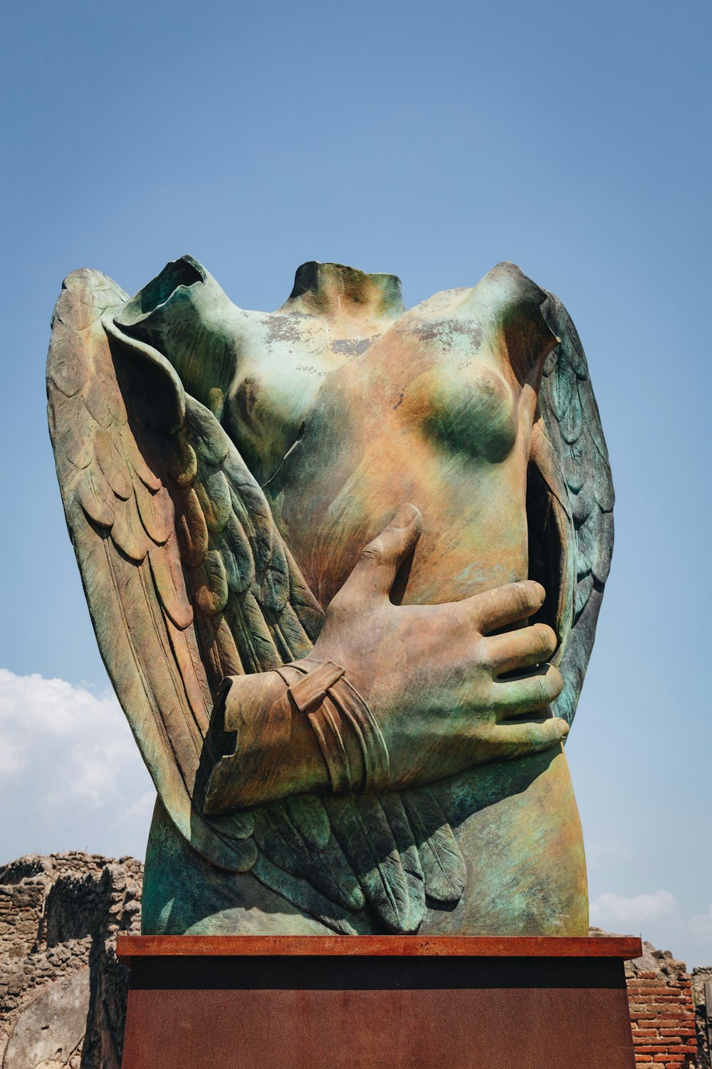 a statue of an angel holding a book