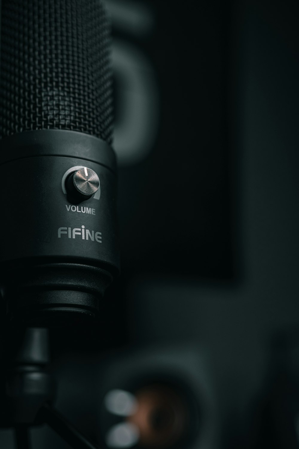 a close up of a microphone with a black background