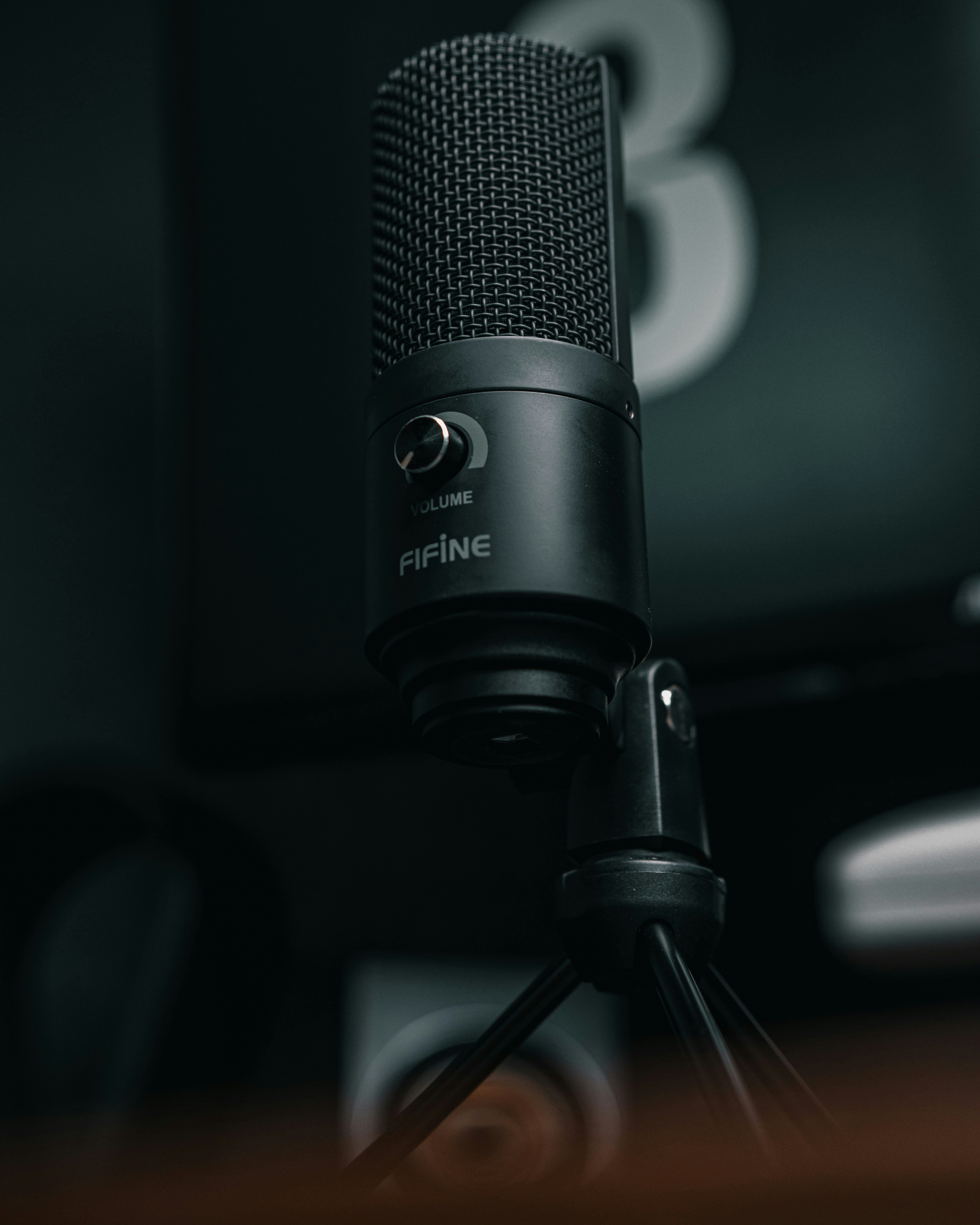 a black microphone is sitting in front of a television