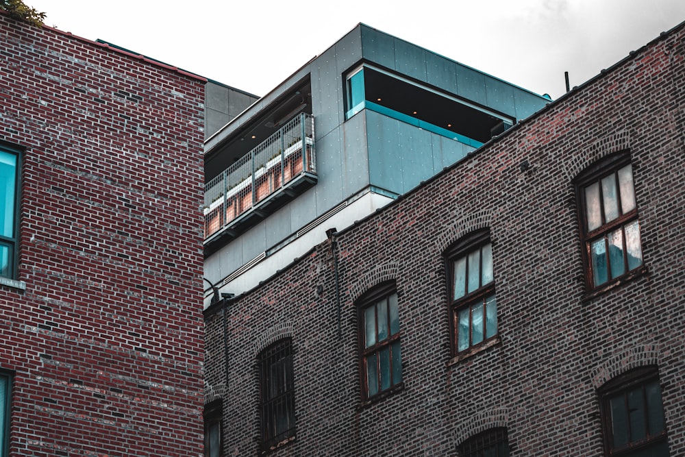 a tall brick building with a sky background