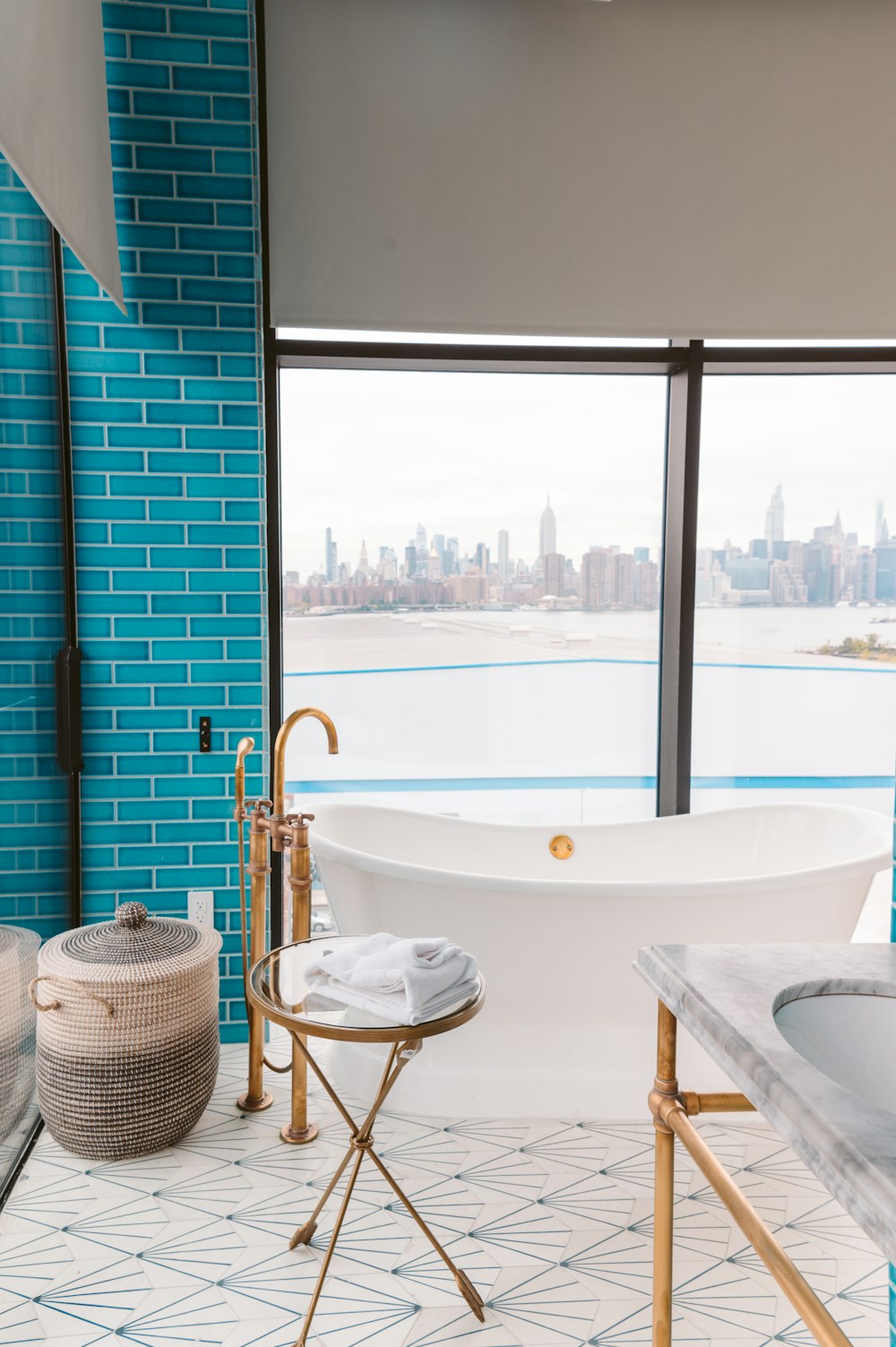 a bathroom with a large tub and a large window