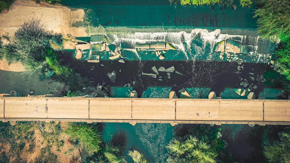 an aerial view of a bridge over a body of water