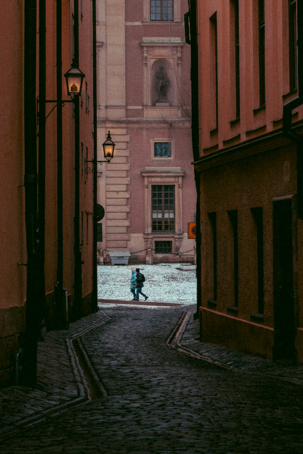 a close up of a street in front of a brick building