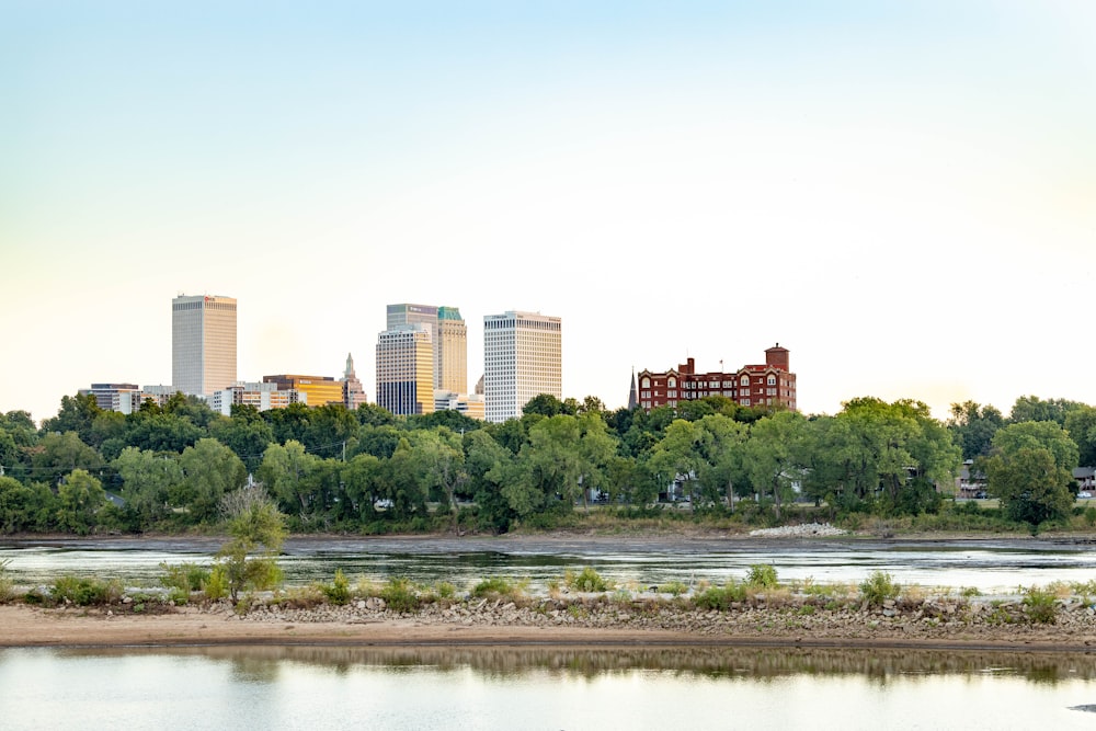 a body of water with a city in the background