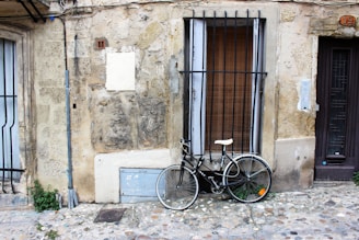 An old-fashioned bicycle leaning against a brick wall in the heart of Dublin’s Coombe.