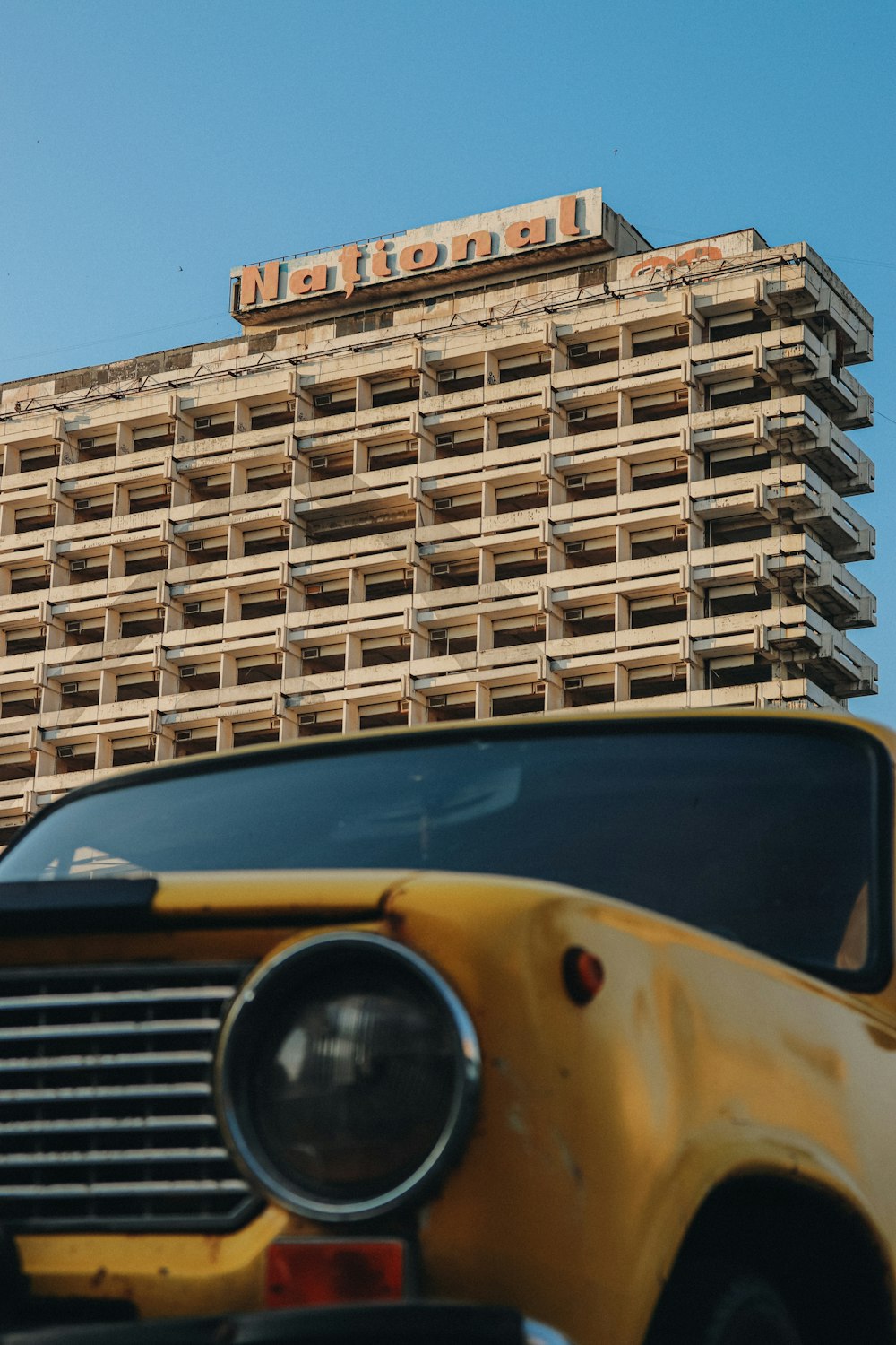 a close up of a school bus parked in front of a building