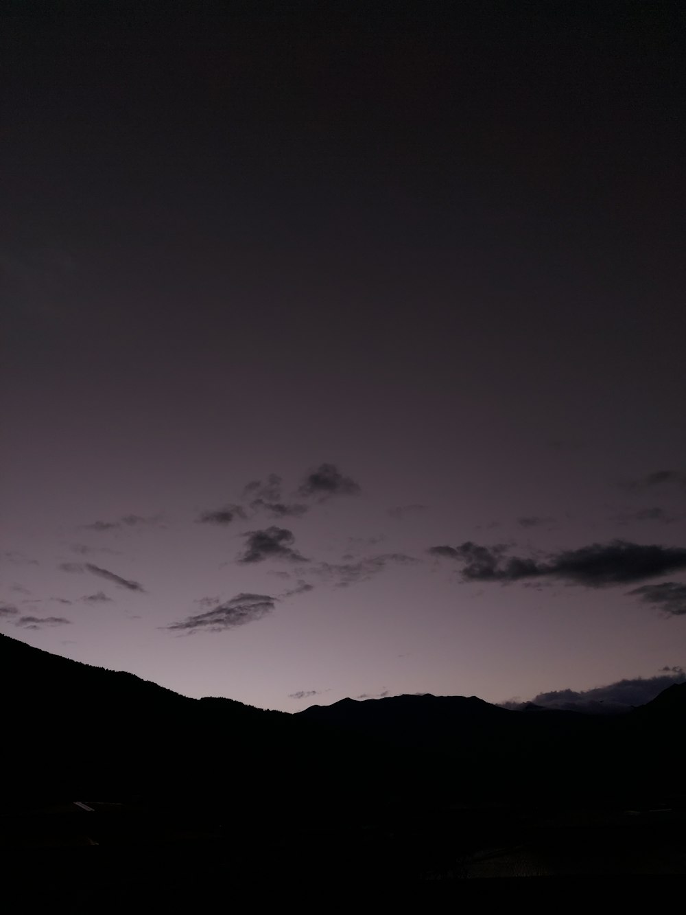 a plane is flying in the sky at night