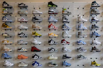 a display of various shoes on a wall