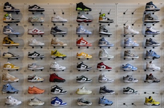 a display of various shoes on a wall