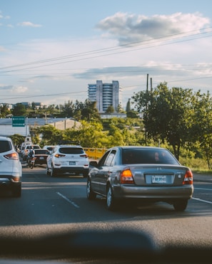 a bunch of cars that are sitting in the street