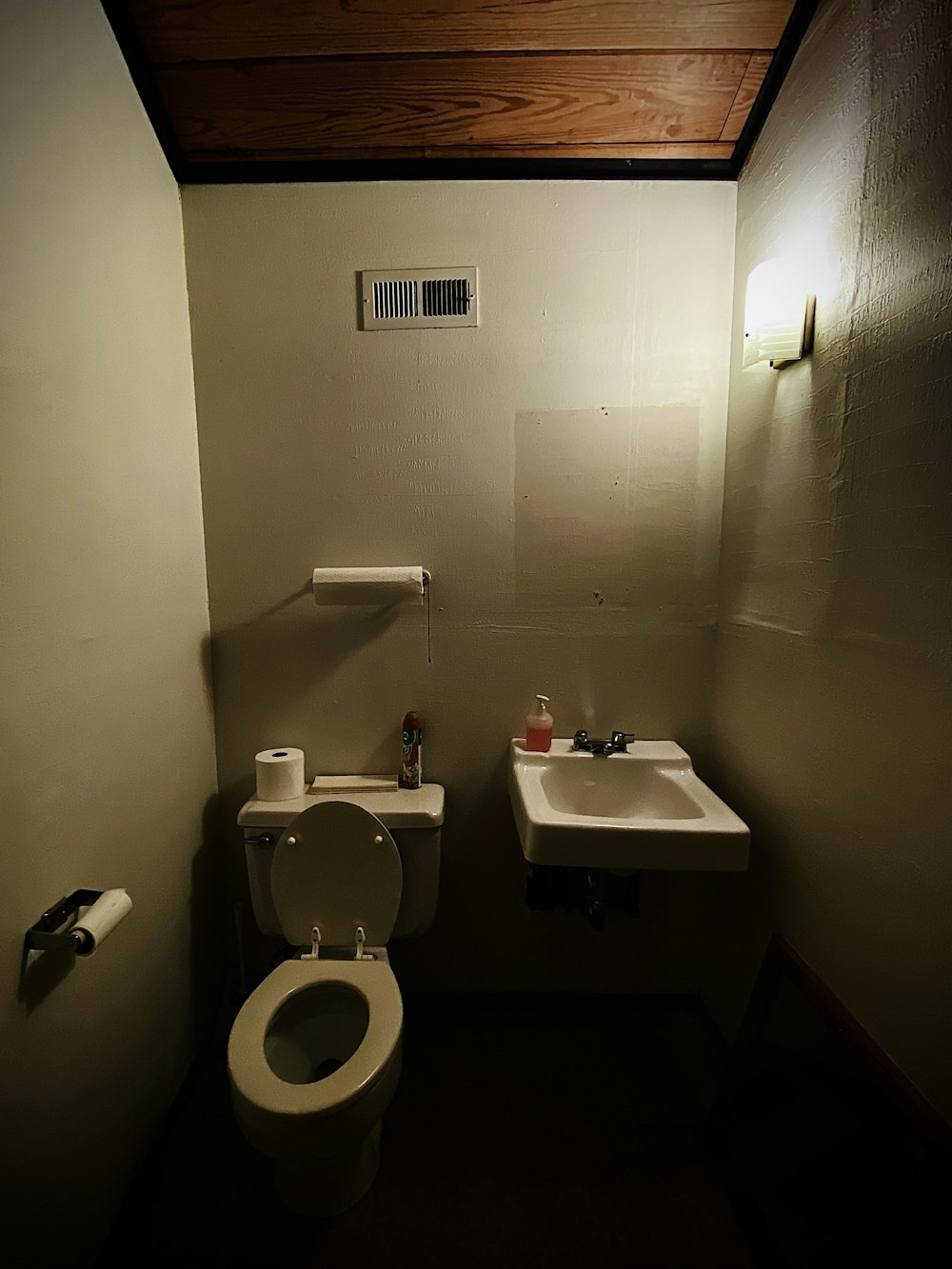 a bathroom with a toilet and a sink