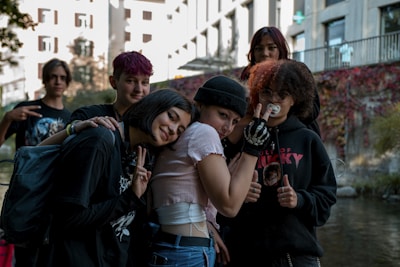 a group of young people standing next to each other