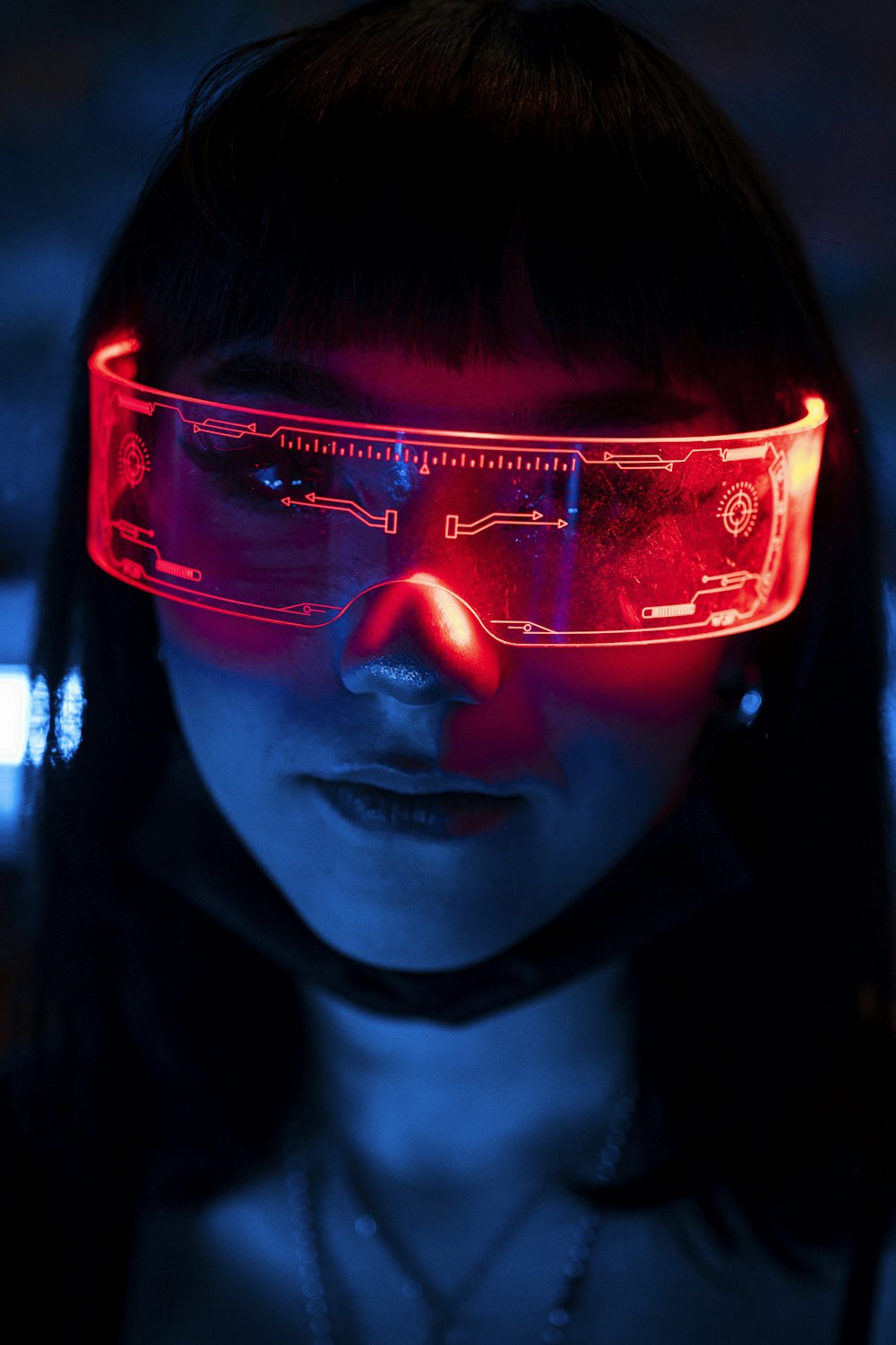 a woman wearing a pair of red glasses