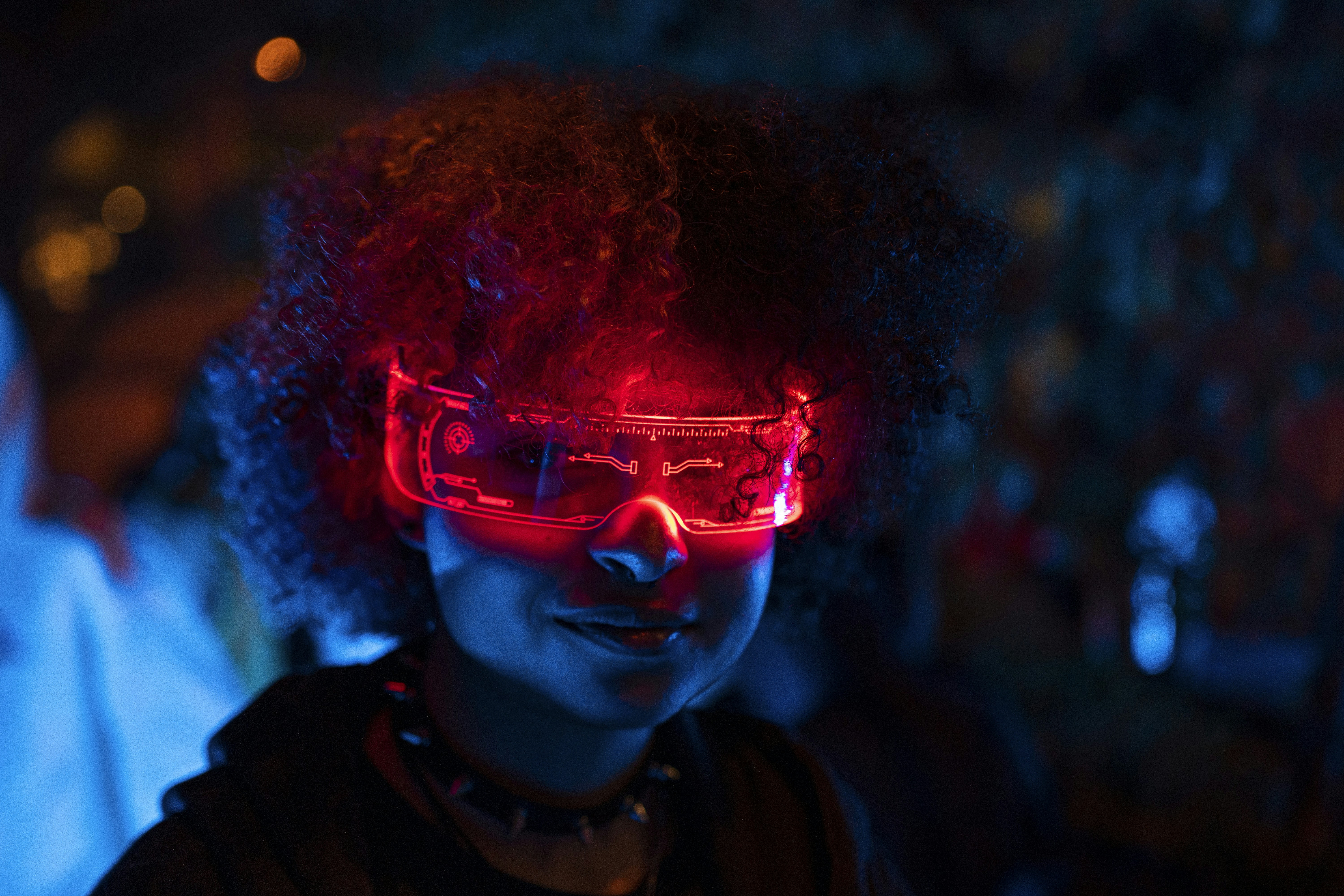 augmented reality glasses person wearing - a person wearing a pair of red glasses