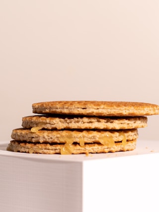 a stack of crackers sitting on top of a white box