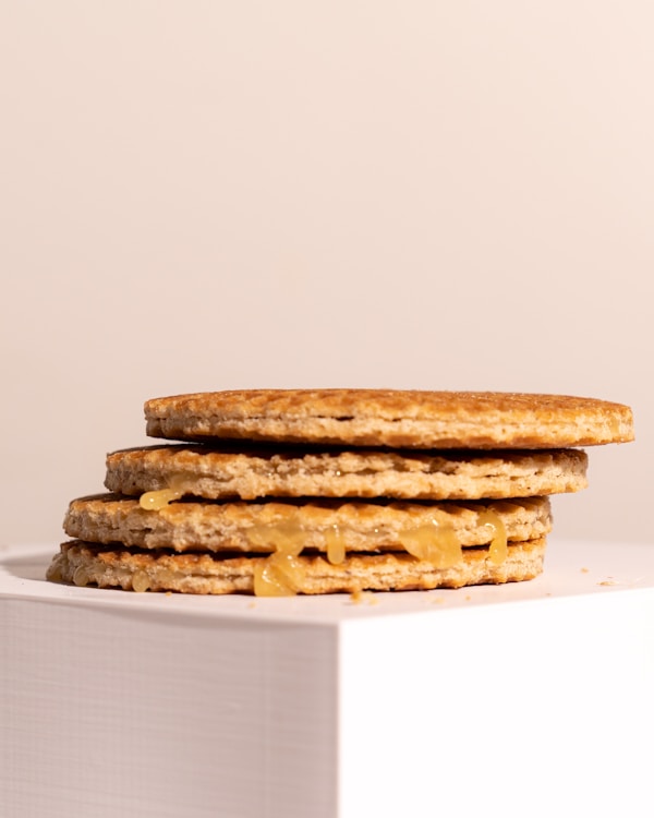 A stack of crackers sitting on top of a white box