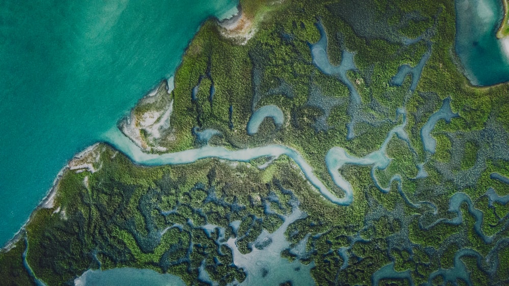 an aerial view of a body of water surrounded by land