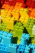 a close up of many different colored legos