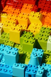 a close up of many different colored legos