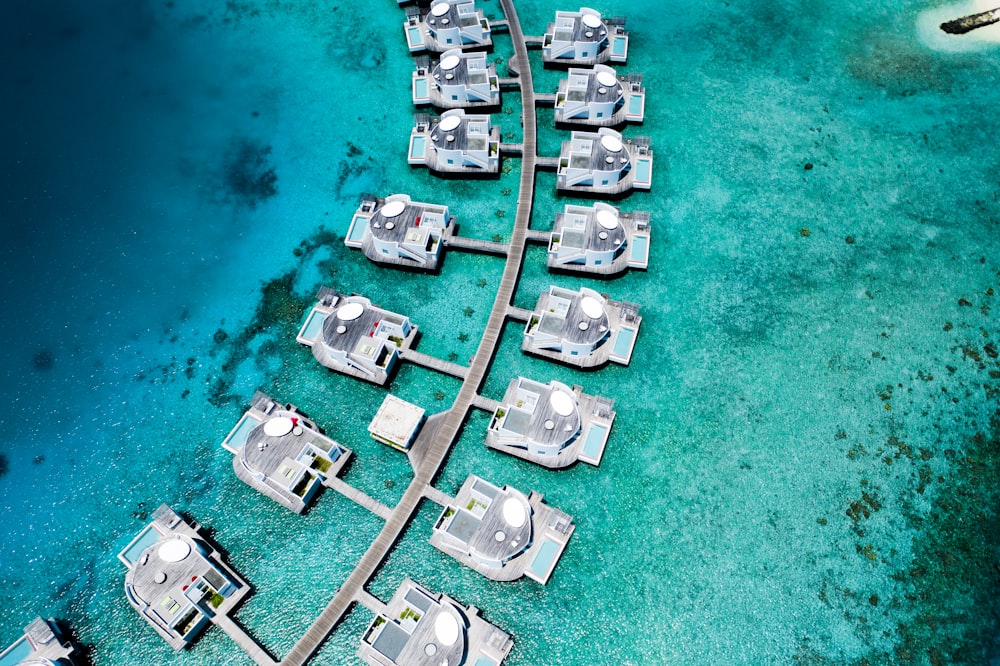 an aerial view of a resort in the ocean