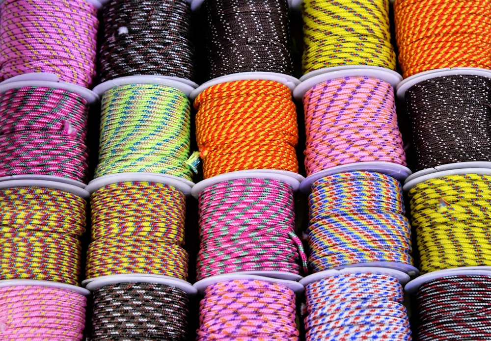 a bunch of different colored rope on a table