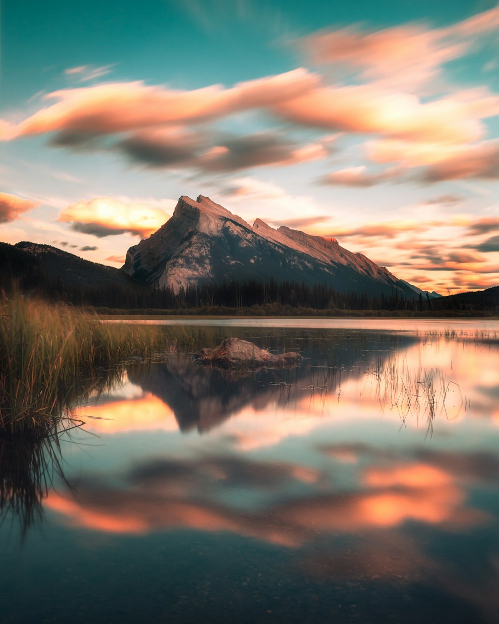 a lake with a mountain in the background